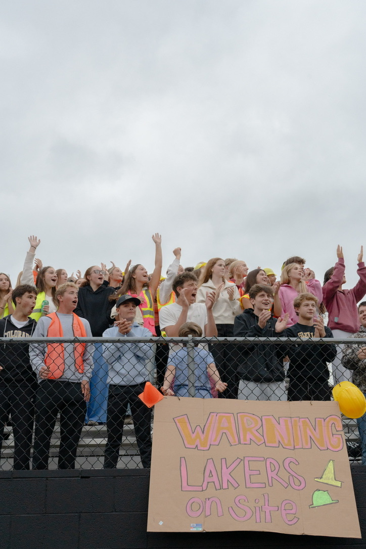 spectators cheering in bleachers